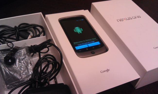Nexus One at boot-up screen, with accessories and original packaging